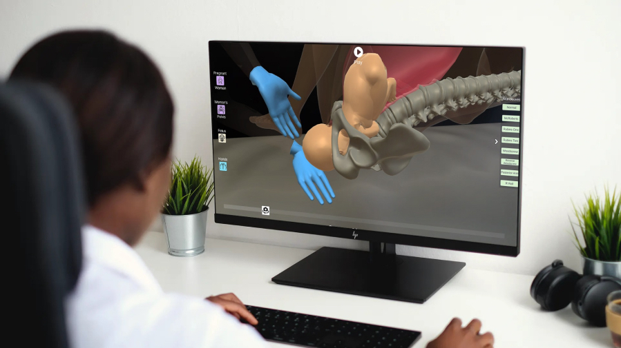 Picture of a woman looking at a 3D animation of shoulder dystocia