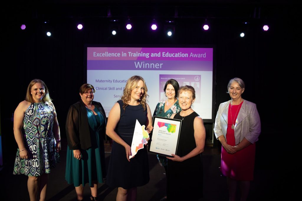 CSDS representatives accepting the Excellence in Training and Education Award for MEP, from left to right: Tracey McLean, A/Learning & Development Manager; Kate Britton, Delivery Support Manager; Mia McLanders, Human Factors, Research & Evaluation Lead; Rachel Weller, A/Office of Strategy Manager; Sue Hampton, Nurse Educator (Midwifery); Bonny Barry, Metro North Board Member