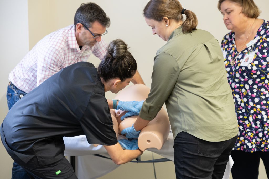 Clinician practicing emergency birth skills in the CSDS Maternity Emergency Program (MEP)