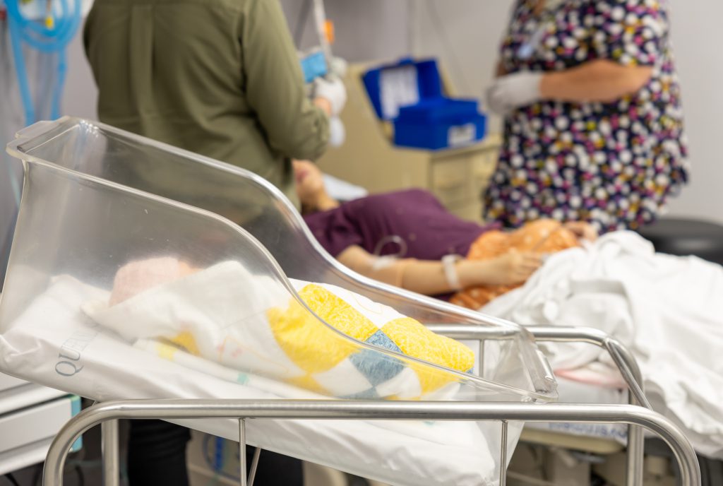 alt="Clinicians participating in Maternity Emergency Program training at CSDS Clinicians practicing emergency birth skills in the CSDS Maternity Emergency Program (MEP)